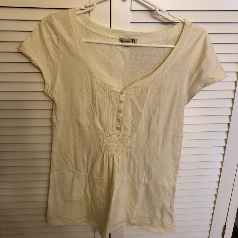 One World cream colored t shirt